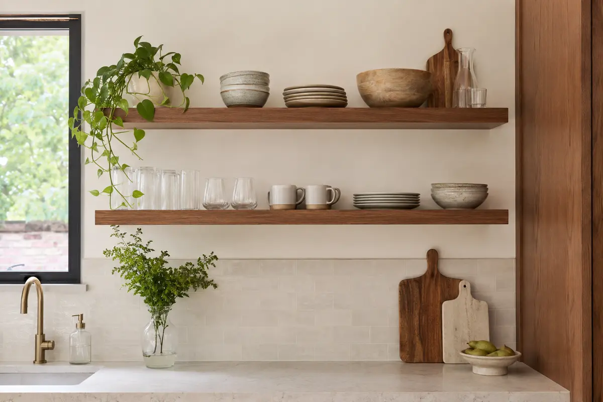 Secure floating kitchen shelves holding everyday dishes and glassware