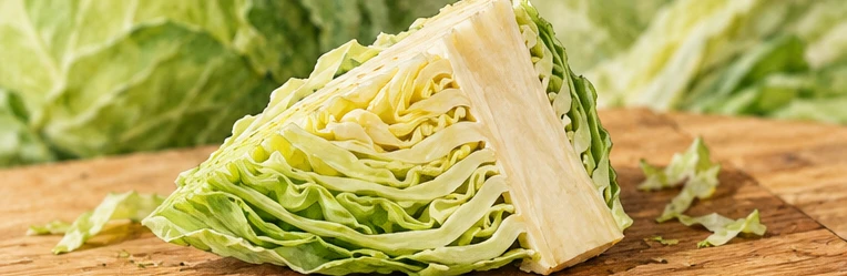 Cabbage wedge with leafy layers attached to a strip of core